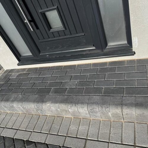 front charcoal block paved driveway side entrance 43